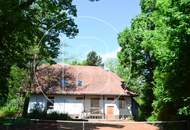 Einfamilienhaus in zentraler Bestlage mit Tennisplatz auf parkähnlichem Grund!