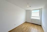 Hofseitig orientierte Zwei-Zimmer-Wohnung mit Einbauküche