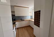 Neuwertige 2-Zimmer-Eigentumswohnung mit Kamin, Loggia und Garage