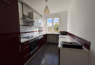 Ruhige 2-Zimmer Wohnung mit Grünblick, Terrasse und 2 Garagenplätzen