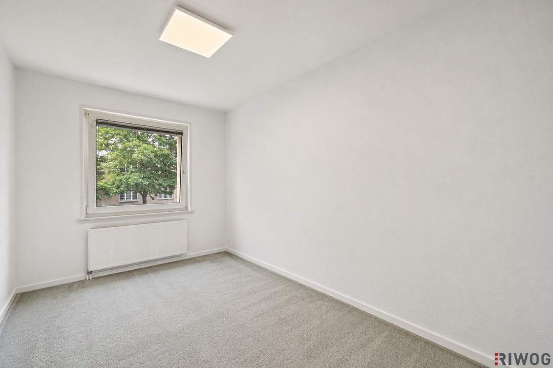Neubauwohnung mit Grünblick und 4-Zimmer Möglichkeit in einem gepflegten Haus