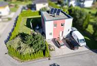 DREI SEEN. EIN ZUHAUSE. – Modernes Wolf Haus mit Garten und Vollkeller in Feld am See