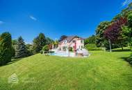 Beeindruckende Villa mit gepflegtem Garten und Pool als Investment