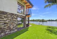 An Exceptional Waterfront Retreat with Private Beach and Unrivaled Privacy