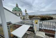 Single-Wohnung mit Schlafnische und Gemeinschaftsdachterrasse direkt beim Karlsplatz!