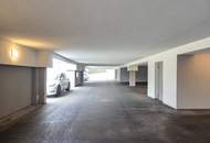 Neuwertige Eigentumswohnung mit Eigengarten sowie eine private Dachterrasse und zwei Garagenparkplätze.