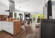 Zuhause im Grünen – Lichtdurchflutete Maisonette mit Gartenoase und Wasserblick