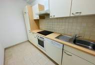 Helle 2‑Zimmer‑Wohnung mit Einbauküche, Parkplatz & Keller