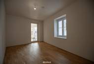 Neubauwohnung im Stadtzentrum mit Ausbaupotenzial & Dachterrasse