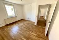 Günstige Starterwohnung in herrlicher Grünlage: praktische 1-Zimmerwohnung mit heller Wohnküche und separatem Schlafzimmer im kleinen Mehrparteienhaus – ideal für Singles, Studierende oder Pendler!