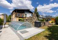 Einfamilienhaus mit Salzwasserpool, Wintergarten, Garage und zwei Carports