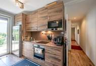 "Kaminfeuer trifft Gartentraum: Topmoderne Gartenwohnung im Wienerwald"