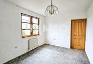 Zweifamilienhaus mit großem Grundstück und Entwicklungspotenzial in Ruhelage