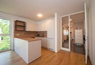 NEUER PREIS! Moderne neuwertige Wohnung mit Einbauküche, Loggia und Tiefgaragenplatz in zentraler Lage!