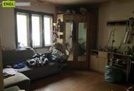 7,6 % Rendite – vermietete Doppelhaushälfte mit zusätzlicher Wohneinheit zur Renovierung und Selbstnutzung.