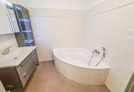Sofort beziehbar! Neubauwohnung mit neuer Küche, 10m2 Balkon, Parkplatz und Grünblick - Fernwärme