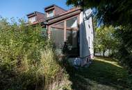 "Familienfreundliches Einfamilienhaus mit Wellnessbad, Sauna, Kachelofen, Fußbodenheizung, großem Garten und Doppelgarage in Tulln"