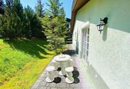 Wohnkomfort in idyllischer Lage - hinreißender Bungalow mit malerischem Garten in Seefeld!