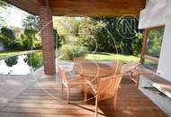 Einfamilienhaus in zentraler Bestlage mit Tennisplatz auf parkähnlichem Grund!