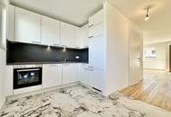 STUDIO-WOHNUNG mit Balkon! I Stellplatz in hauseigener Tiefgarage I hochwertige Einbauküche I Fußbodenheizung I bodenebenerdige Dusche I U1 ca. 13 min. mit Öffis