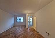 EINMALIGE CHANCE: TRAUMHAFTE BALKONWOHNUNG IN BEGEHRTER WOHNLAGE IM ERSTBEZUG MIT MÖGLICHKEIT AUF TIEFGARAGENPARKPLATZ