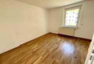 Günstige Starterwohnung in herrlicher Grünlage: praktische 1-Zimmerwohnung mit heller Wohnküche und separatem Schlafzimmer im kleinen Mehrparteienhaus – ideal für Singles, Studierende oder Pendler!