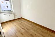 Herrlich sanierte Erdgeschosswohnung mit moderner Wohnküche, stilvollem Badezimmer und Grünblick - in ruhiger Siedlungslage mit ausgezeichneter Infrastruktur, ideal für kleine Familien!