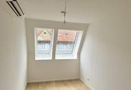 Eleganz trifft Lage – Neubau-Dachgeschosswohnung in Toplage