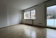 Großzügige Eigentumswohnung mit Balkon, Wintergarten, Gartenanteil und Garagenparkplatz in St. Gertraud