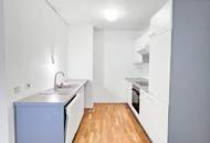 Neubauwohnung mit Süd-Balkon in ruhigen Innenhof und Garage | Einbauküche | U-Bahn- und Donauinselnähe