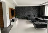 Luxuriöses Wohnen: Designhaus mit Garten, Pool und geräumiger Garage