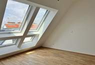 Erstbezug! Schöne Dachgeschosswohnung mit Terrasse