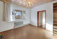 "Ankommen am Promenadenweg: Bungalow im Grünen – nahe Wien mit Potential"