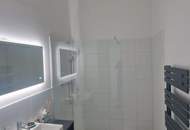 Sonnige, neue 3 Zi-DG-Wohnung mit Terrasse und TG-Platz