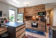 "Kaminfeuer trifft Gartentraum: Topmoderne Gartenwohnung im Wienerwald"