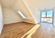 Exklusive 2-Zimmer-DG-Wohnung mit Weitblick und außergewöhnlichem Lichteinfall