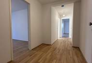 Erstbezug: 3 Zimmer-Mietwohnung mit sonnigen Terrassenflächen und Garten