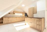 Traumhafte Dachgeschosswohnung – Erstbezug in hochwertig gebautem Wohnhaus - Klimaanlage - Moderne Küche - Gemeinschaftsgarten