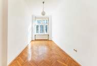 Altbau-Charme mit 3 Zimmern und Süd-Balkon in zentraler Lage