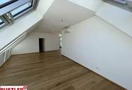 Erstbezugs-Dachgeschosswohnung in zentraler Lage