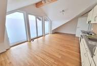 Ideal für Singles oder Paare – neuwertige Mansardenwohnung mit Balkon und Carport