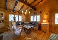 „Wohnen im Einklang mit der Natur – Stilvolles Holzhaus in traumhafter Ruhelage auf unverbaubarem Grundstück“