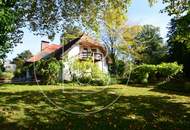 Einfamilienhaus in zentraler Bestlage mit Tennisplatz auf parkähnlichem Grund!