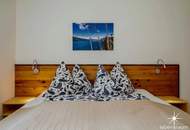 Etabliertes Ferienhaus-Ensemble am Millstätter See. Zwei moderne Häuser mit bestehender Vermietung. Investment.