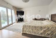 Zeitlose Architektur trifft Großzügigkeit - Designvilla mit Indoor-Pool und Einliegeroption