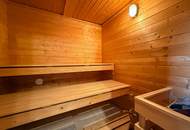 Chalet-Feeling mitten in Donaufeld - Naturstamm-Blockhaus mit Sauna, Kamin und Garten