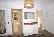 Helle Familienwohnung mit überdachter Sonnenterrasse und Eigengarten