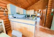 Chalet-Feeling mitten in Donaufeld - Naturstamm-Blockhaus mit Sauna, Kamin und Garten