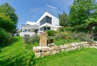 Luxus im Grünen: Architektenvilla mit mediterranem Flair und Alpenpanorama