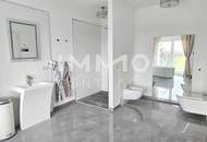 Zeitlose Architektur trifft Großzügigkeit - Designvilla mit Indoor-Pool und Einliegeroption